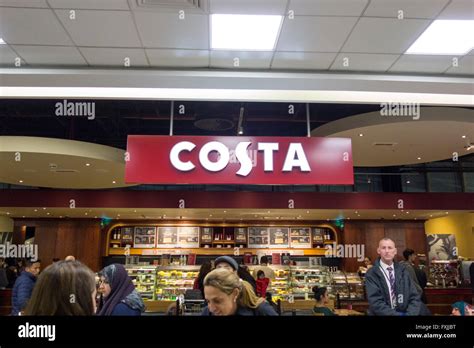 Costa sign at Heathrow terminal 4 arrivals Stock Photo: 102442476 - Alamy