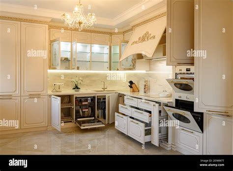 Luxury beige and gold classic kitchen interior Stock Photo - Alamy