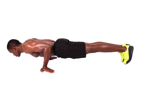 Fit athletic man doing semi planche push ups