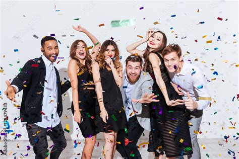 Group of happy young people celebrating and having fun together Stock Photo | Adobe Stock