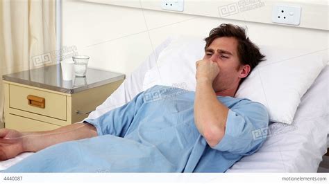 Sick Man Lying On Hospital Bed Coughing Stock video footage | 4440087