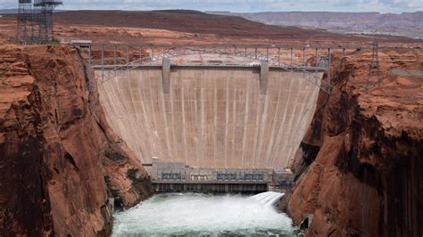 A flood from Glen Canyon Dam temporarily lifts Grand Canyon beaches