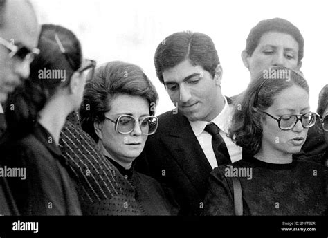 Jehan Sadat, widow of assassinated Egyptian President Anwar Sadat stands with Reza Pahlevi, son ...