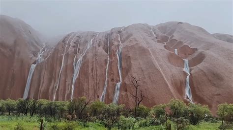 Rare Rainstorm Creates Waterfalls on Uluru » Explorersweb