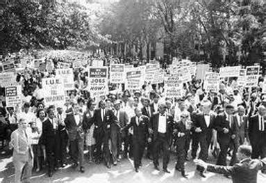 Many protesters march in a parade.