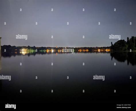 Lake night view with lights reflection on it Stock Photo - Alamy