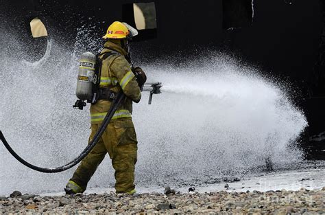 Firefighter In Action 1 Photograph by Bob Christopher