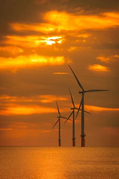 Wind turbine on sunset — Stock Photo © ssuaphoto #5599436