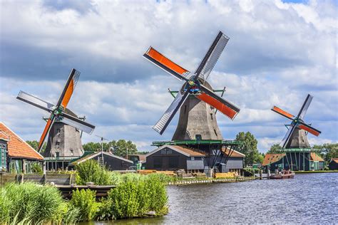 Traditional Dutch old wooden windmill in Zaanse Schans, The Netherlands ...