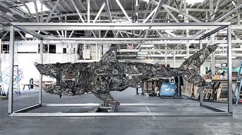 Here’s A Look At Street Artist RISK’s Massive Scraps-made Shark Sculpture