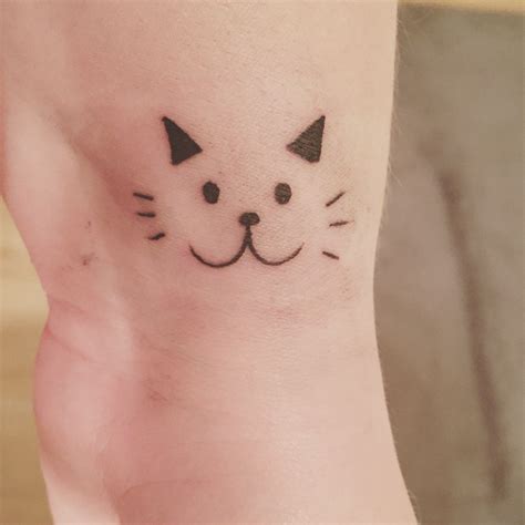 Cat face tattoo