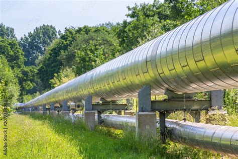 Huge metal gas pipeline transporting gas Stock Photo | Adobe Stock