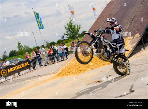 Stunt style - motorcycles trick Stock Photo - Alamy