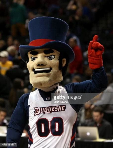 The Duquesne Dukes mascot walks on the court during a stoppage... News Photo - Getty Images