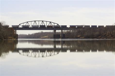 Railroad bridge over water Photograph by Barb Cryer