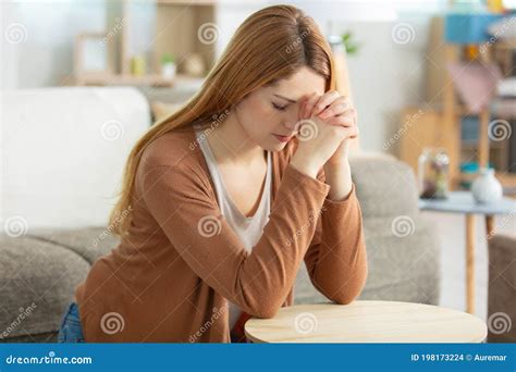 Woman Kneeling in Prayer in Living Room Stock Photo - Image of life, belief: 198173224