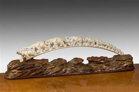 A Japanese ivory tusk carving of a group of elephants | Wick Antiques