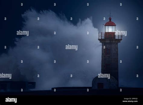 Old lighthouse under a heavy storm at night Stock Photo - Alamy