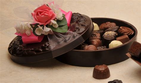 Belgian Chocolater Piron creates beautiful edible boxes made from our Belgian Chocolate, filled ...