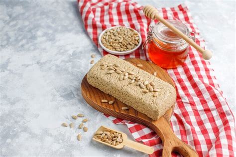 Free Photo | Homemade sunflower halva on cutting board with sunflower seeds