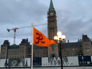 Hindu saffron flag with Om raised during Diwali celebration in Canadian ...