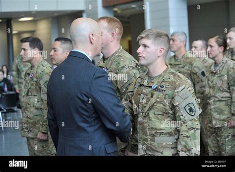 Nebraska Governor Pete Ricketts shakes the hand of Nebraska National ...