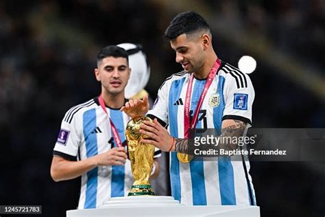 Cristian ROMERO of Argentina with the World Cup Trophy after the FIFA ...