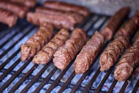 Meat Rolls Called Mici or Mititei on Barbecue. Close Up of Grill with Burning Fire with Flame ...