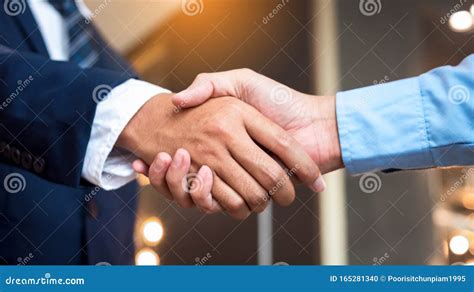 Close Up Businessmen Shaking Hands during a Meeting. Handshake Deal Business Corporate Stock ...