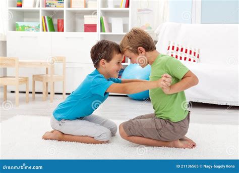 Kids Wrestling On The Floor - Boys Game Royalty-Free Stock Photo | CartoonDealer.com #21045339