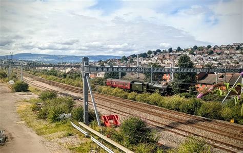 LMS Jubilee Class 45699 'Galatea' hauling it's support coach past East ...