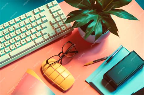 Premium Photo | Office desk with keyboard and plant