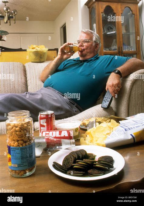 Obese senior man junk food eat abuse fat overweight health poor lazy couch potato drink sugar ...