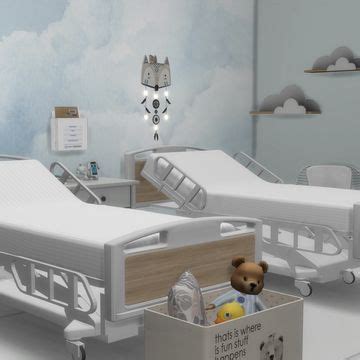 a hospital room with two beds and a teddy bear