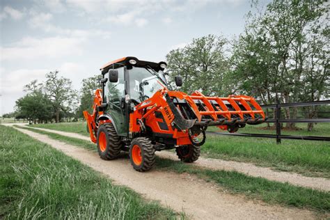 KIOTI Tractor Introduces new Grapple Line and CX Series Cab Tractor - Residential Contractor