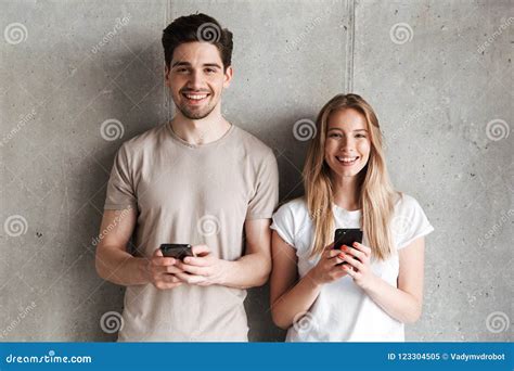 Modern Sociable People Man and Woman Smiling while Both Holding Stock Image - Image of indoor ...