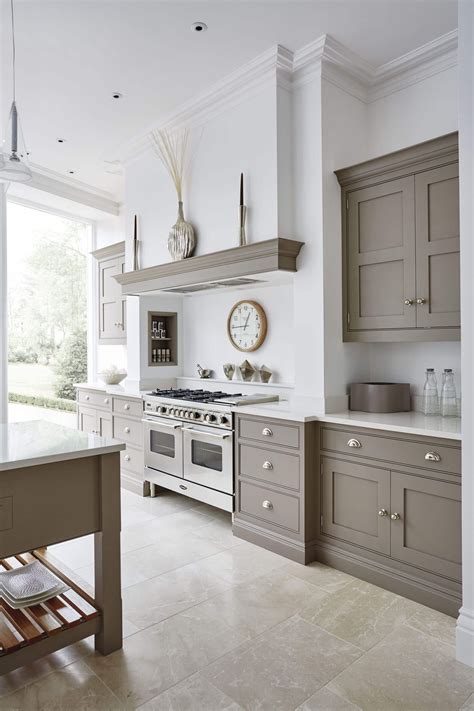 This grey and white kitchen shows a contemporary take on a traditional ...