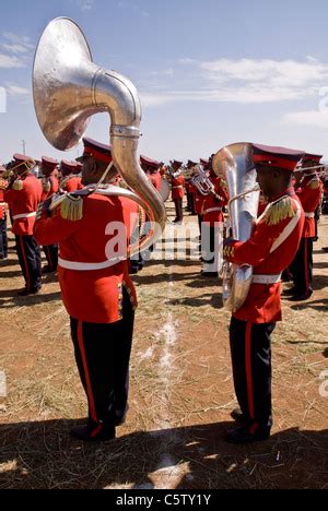 Tuba players from a marching band warming up before a football game ...