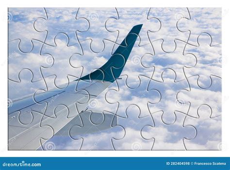 Airplane Wing Above the Clouds in Jigsaw Puzzle Shape Stock ...