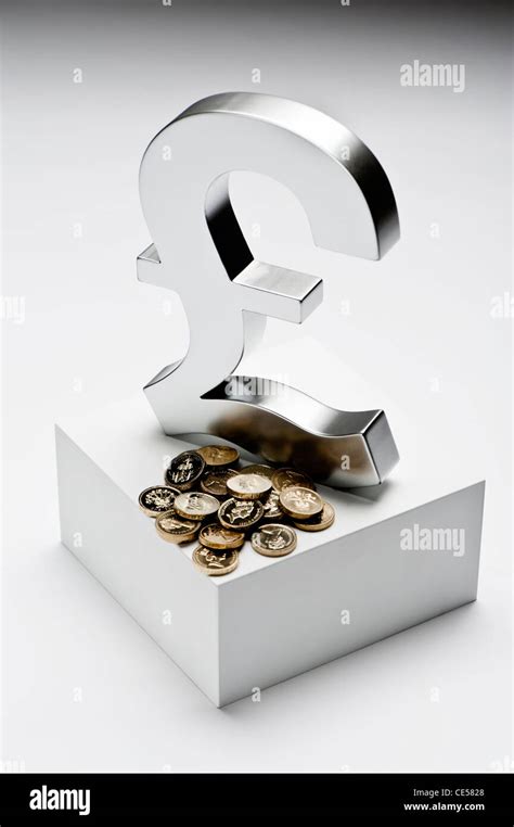 Sterling symbol and coins Stock Photo - Alamy