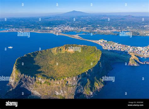 Sunrise view of Seongsan Ilchulbong known as sunrise peak at Jeju Island, Republic of Korea ...