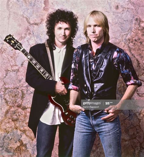 Music legends Tom Petty and Mike Campbell pose for a portrait in...