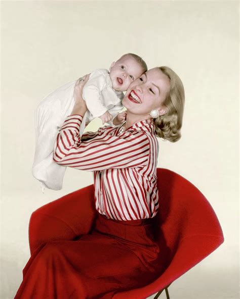 Dina Merrill Holding A Baby Photograph by John Rawlings - Fine Art America