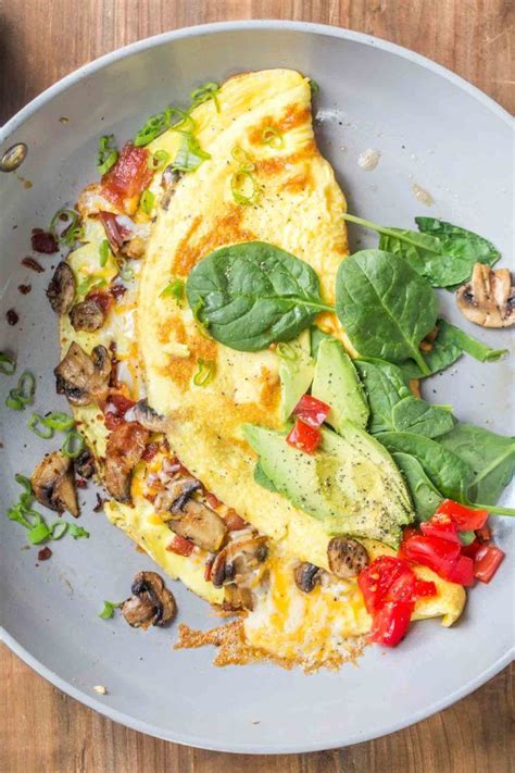 The best homemade omelet recipe loaded with bacon, mushrooms, tomatoes ...