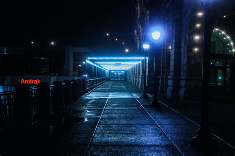 Black Outdoor Pedestal Lamp Near Coaster Train Rail · Free Stock Photo