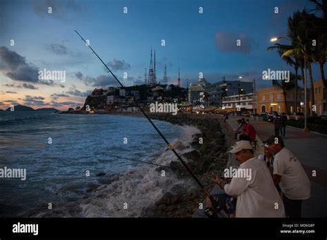 Fishing along the malecón (boardwalk) Mazatlan, Mexico Stock Photo - Alamy