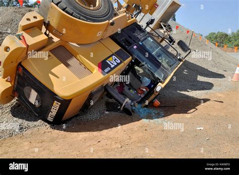 Front End Loader CAT 93OH CATERPILLAR in work accident Stock Photo - Alamy