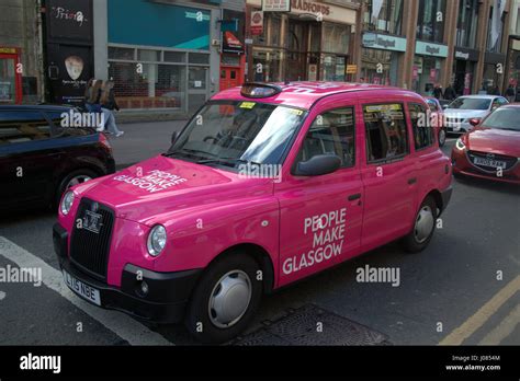 People Make Glasgow pink taxi cab on the street in Scotland Stock Photo ...