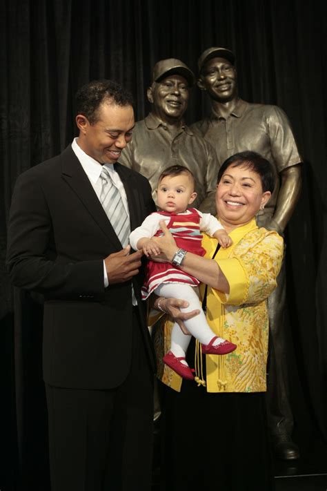 Seeing double: Tiger Woods and son Charlie tee off in perfect symmetry ...