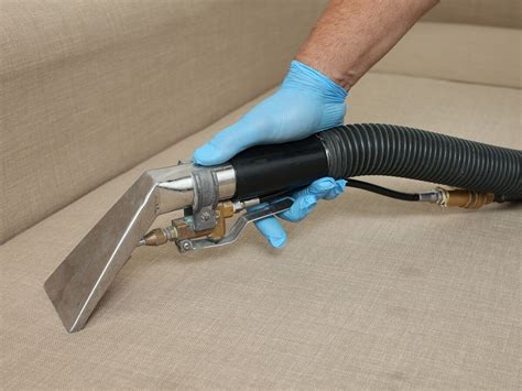 Steam cleaning a sofa as part of Fantastic Cleaners' upholstery cleaning service Cohoes, NY, USA ...